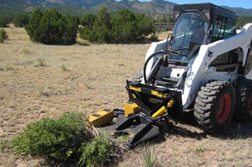 Bobcat S330 with hydraulic shear attachment